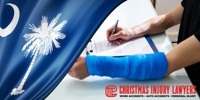 Person with a blue bandage on their arm signing a document, with the South Carolina