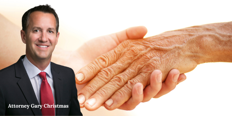 Attorney Gary Christmas extending a handshake, symbolizing Christmas Injury Lawyers’ compassionate, family-first approach to personal