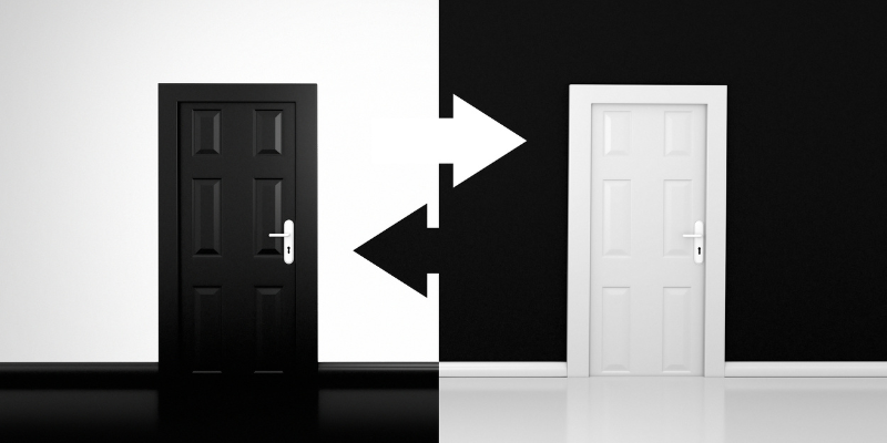 A black door and a white door set against contrasting backgrounds, symbolizing choices and the