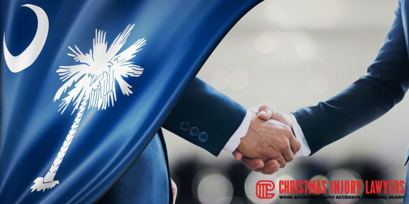 South Carolina state flag waving behind a lawyer shaking hands, symbolizing legal support for workers’