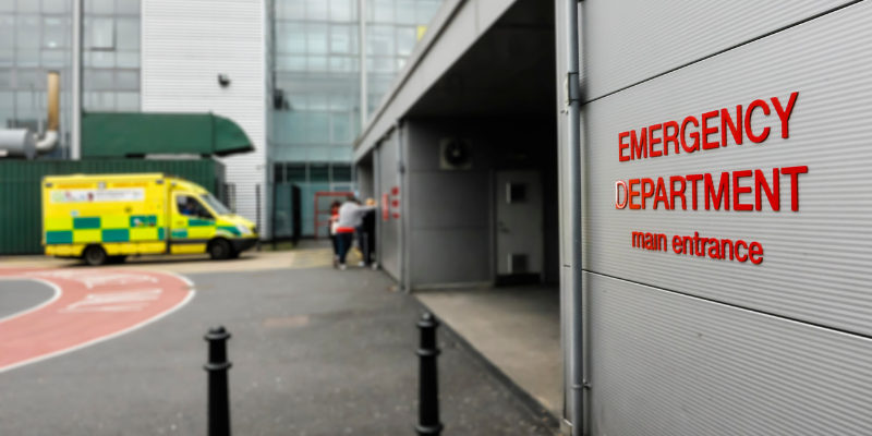 Emergency department entrance with ambulance visible, representing urgent medical care following a motorcycle accident in