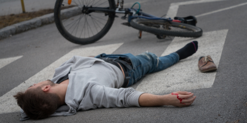A pedestrian accident scene in South Carolina, showing an injured individual lying on a crosswalk