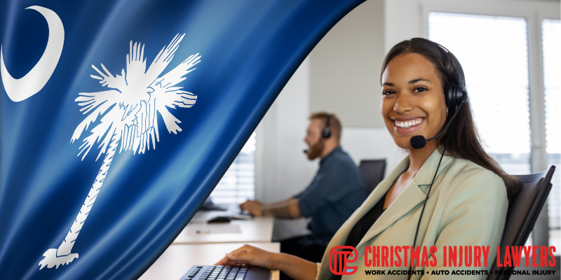 Smiling South Carolina legal representative wearing a headset, assisting with workers’ compensation claim denials and